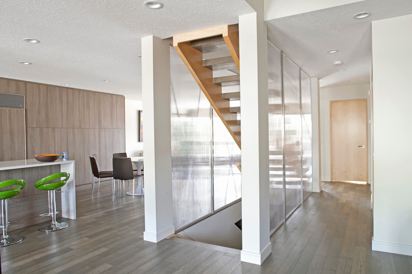 Staircase and kitchen in a private residence